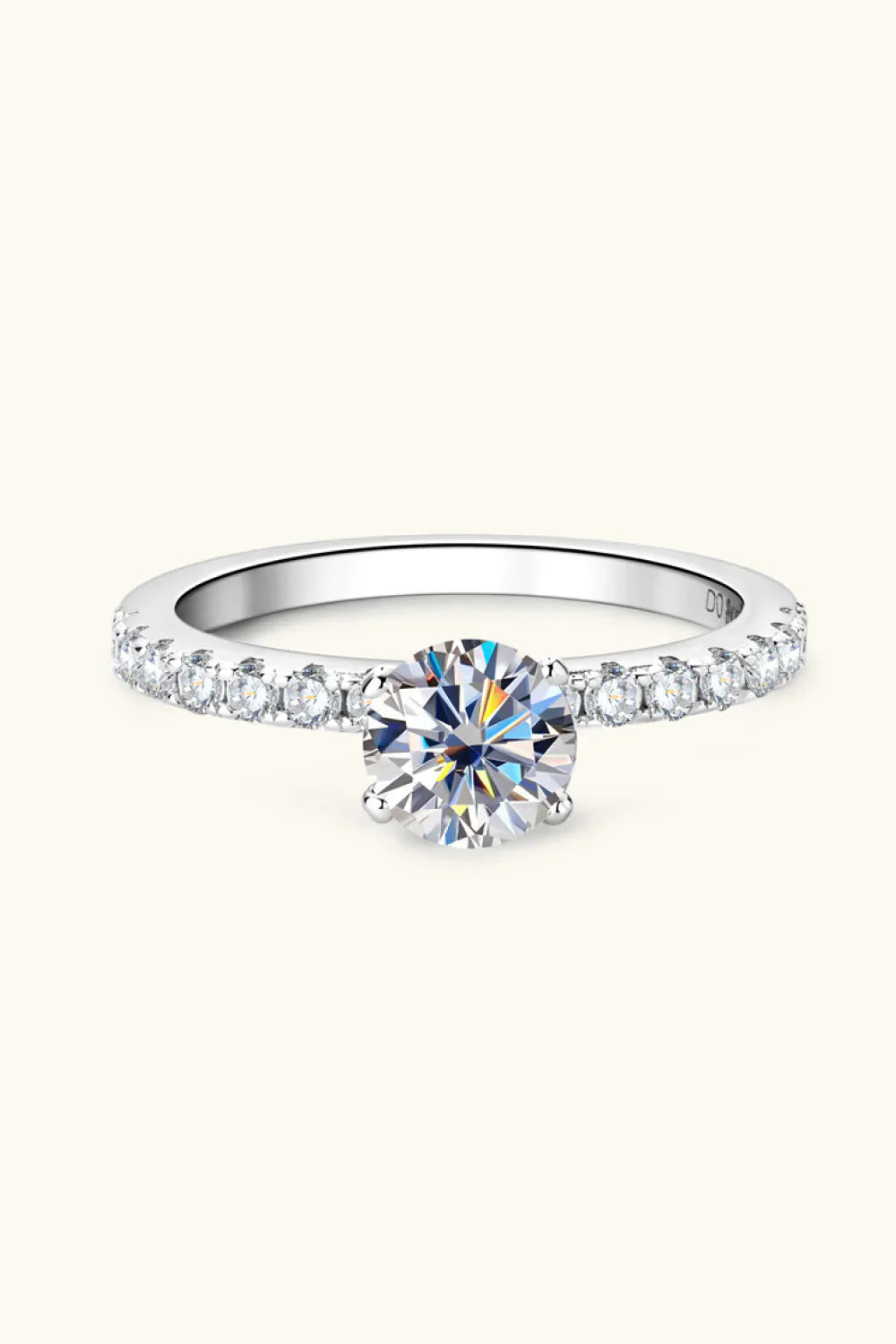 Elegant engagement ring showcasing a sparkling center stone with band, featuring ring size and fit tips