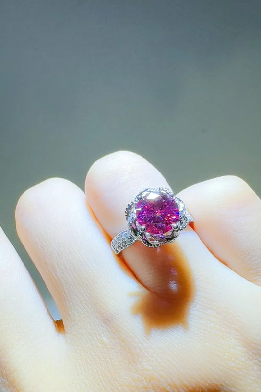 Stylish 2 carat moissanite flower ring with a pink center stone and intricate band details