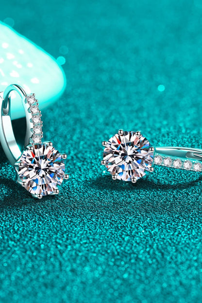 Stunning 4 carat moissanite earrings with sparkling round designs on elegant silver settings