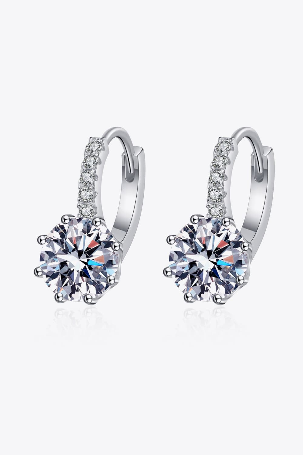 Elegant 4 carat moissanite earrings in silver setting, featuring a sparkling design