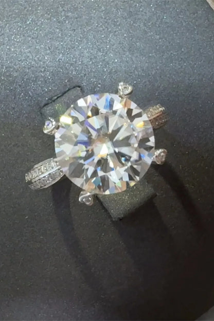 Stunning 5 carat moissanite ring with a sparkling round center stone and detailed band design