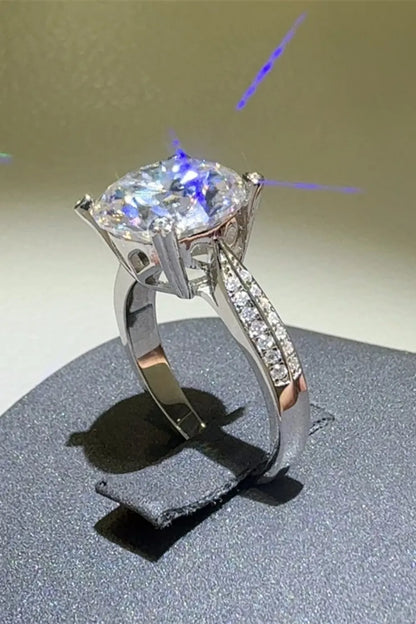 Elegant 5 carat moissanite ring with sparkling side stones and a stunning centerpiece