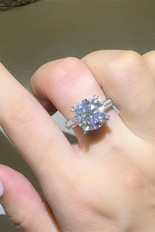 Stunning 5 carat moissanite ring on hand with sparkling details and a classic design