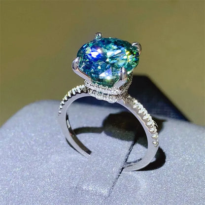 Elegant silver 5 carat moissanite ring featuring a stunning sparkling gemstone and intricate band detailing