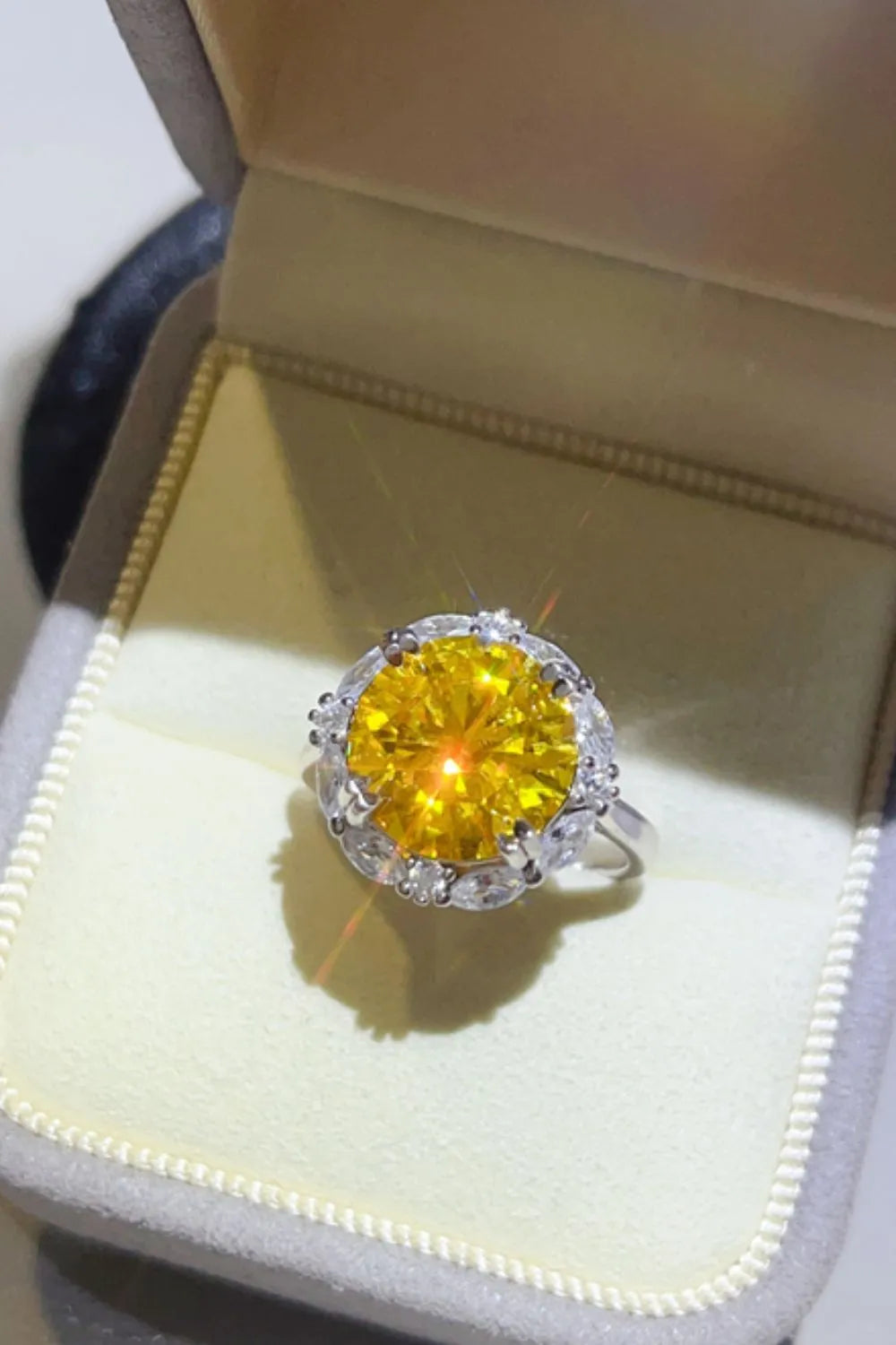 Stunning yellow 5 carat moissanite ring set in silver with sparkling diamond accents