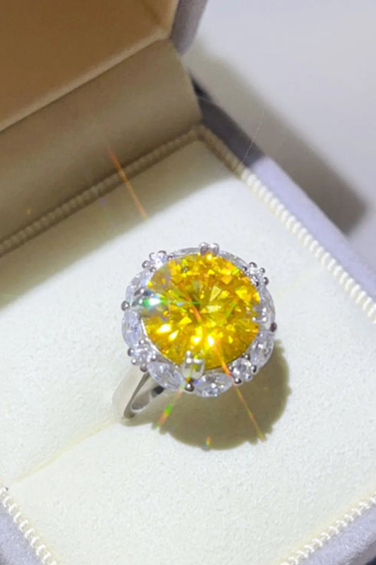 Stunning 5 carat moissanite ring with a yellow center stone and sparkling halo design
