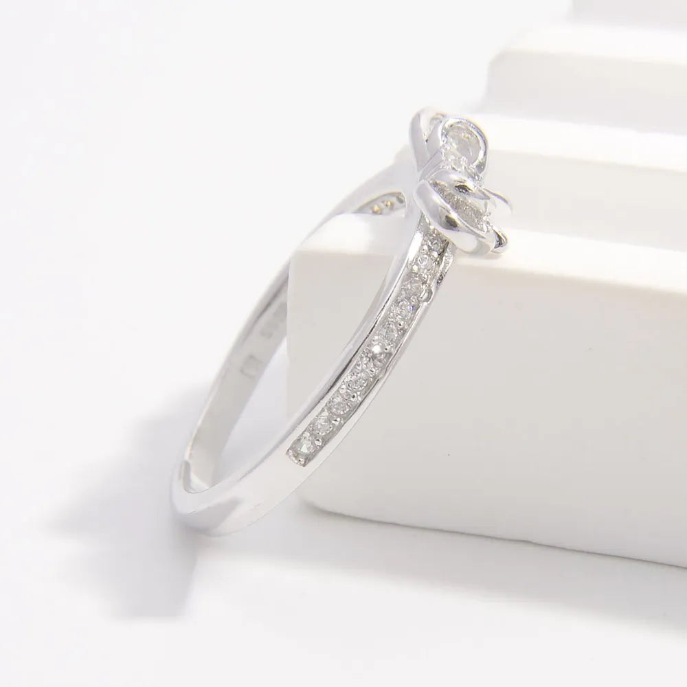 925 sterling silver bow ring with sparkling accents for elegant style and charm
