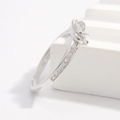 925 sterling silver bow ring with sparkling accents for elegant style and charm