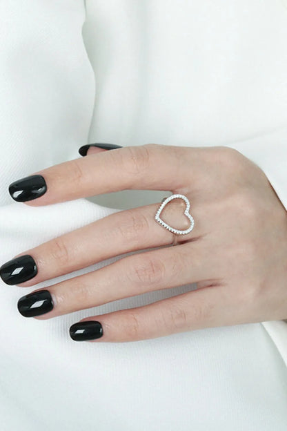 Trendsi 925 sterling silver heart ring with a delicate open design worn on a well-manicured hand