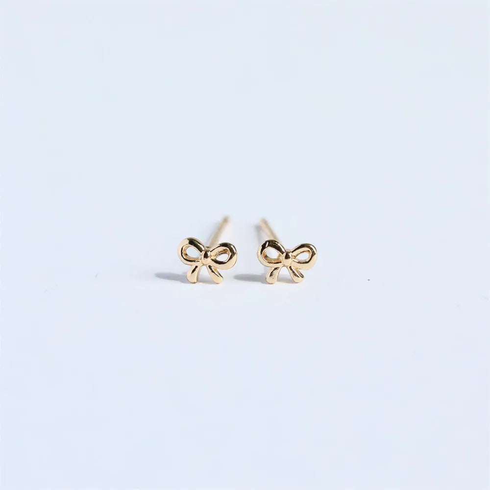 Trendsi copper bow stud earrings featuring a delicate bow design for elegant styling