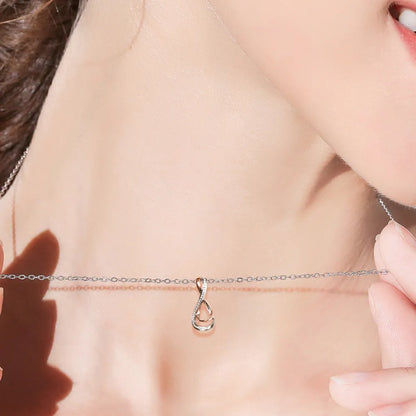 Close-up of elegant infinity necklace for women showcasing a sleek design on a delicate chain