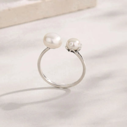 Trendsi elegant pearl jewelry ring featuring two lustrous pearls on a silver band