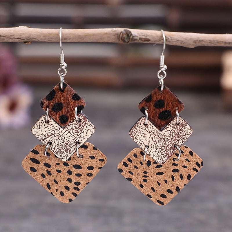 Trendy fashion earrings for women featuring layered design with animal print and textured leather