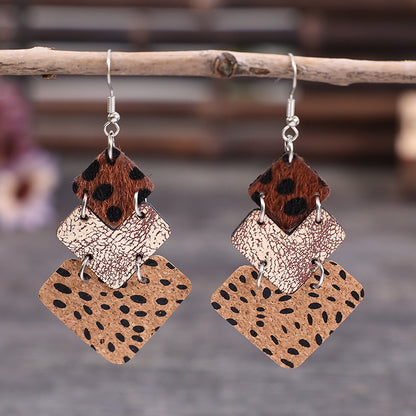 Trendy fashion earrings for women featuring layered design with animal print and textured leather
