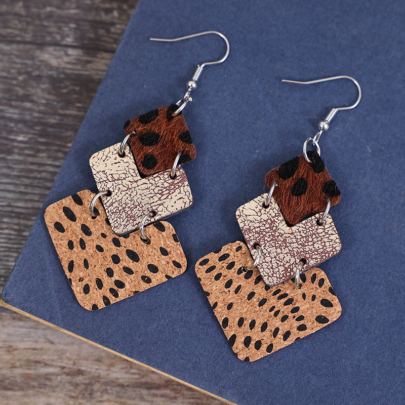 Trendy fashion earrings for women featuring layered leather squares in animal print designs