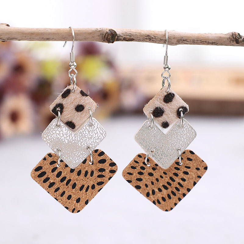 Trendy fashion earrings for women featuring layered geometric designs in animal print and metallic finishes