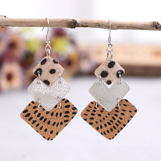 Trendy fashion earrings for women featuring layered geometric designs in animal print and metallic finishes