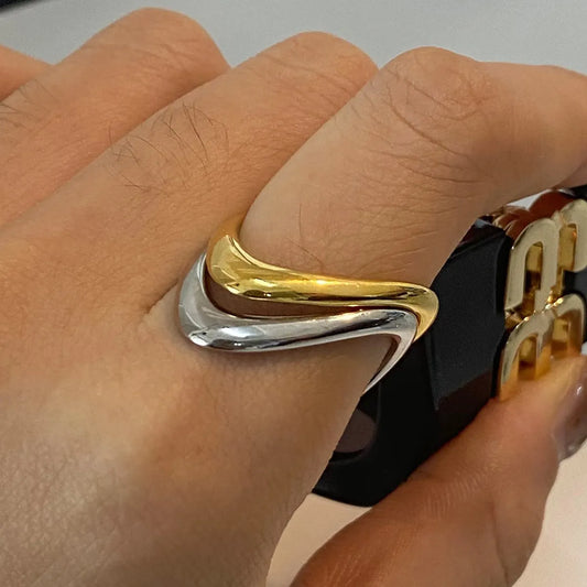 Trendsi gold and silver ring on hand showcasing a sleek and elegant design