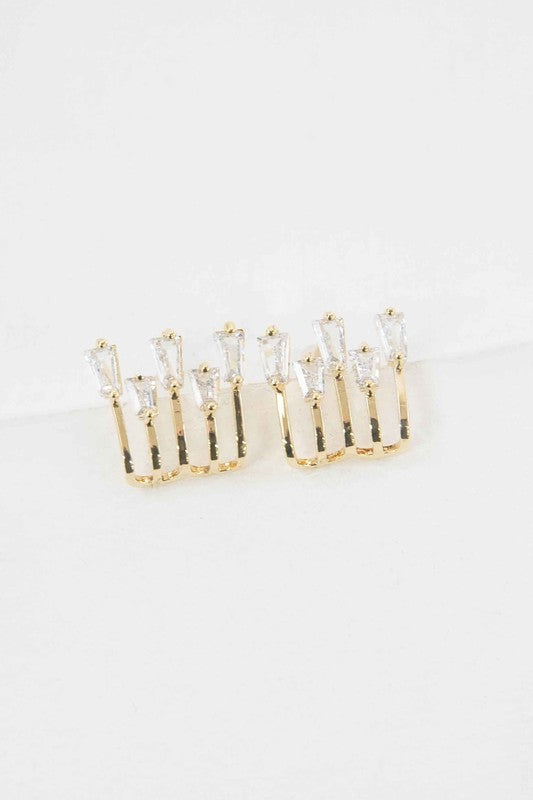 Gold kalimba earrings featuring elegant design with sparkling gemstones for a stylish look
