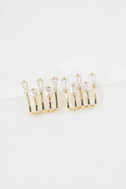 Gold kalimba earrings featuring elegant design with sparkling gemstones for a stylish look