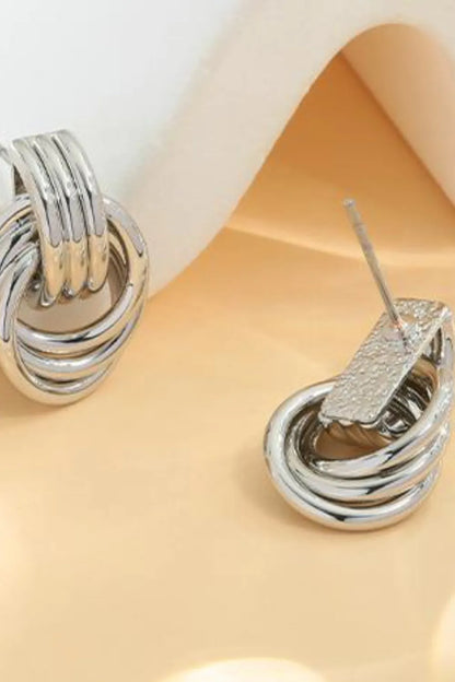 Trendsi gold-plated knot stud earrings featuring a unique twisted design for elegant style