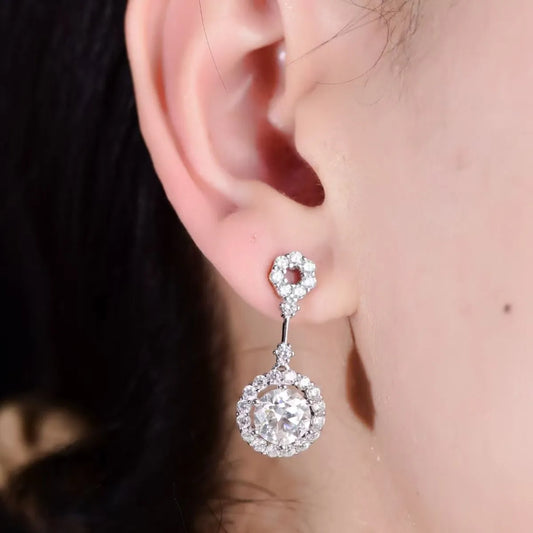 Trendsi halo design dangle earrings featuring sparkling gemstones for elegant style