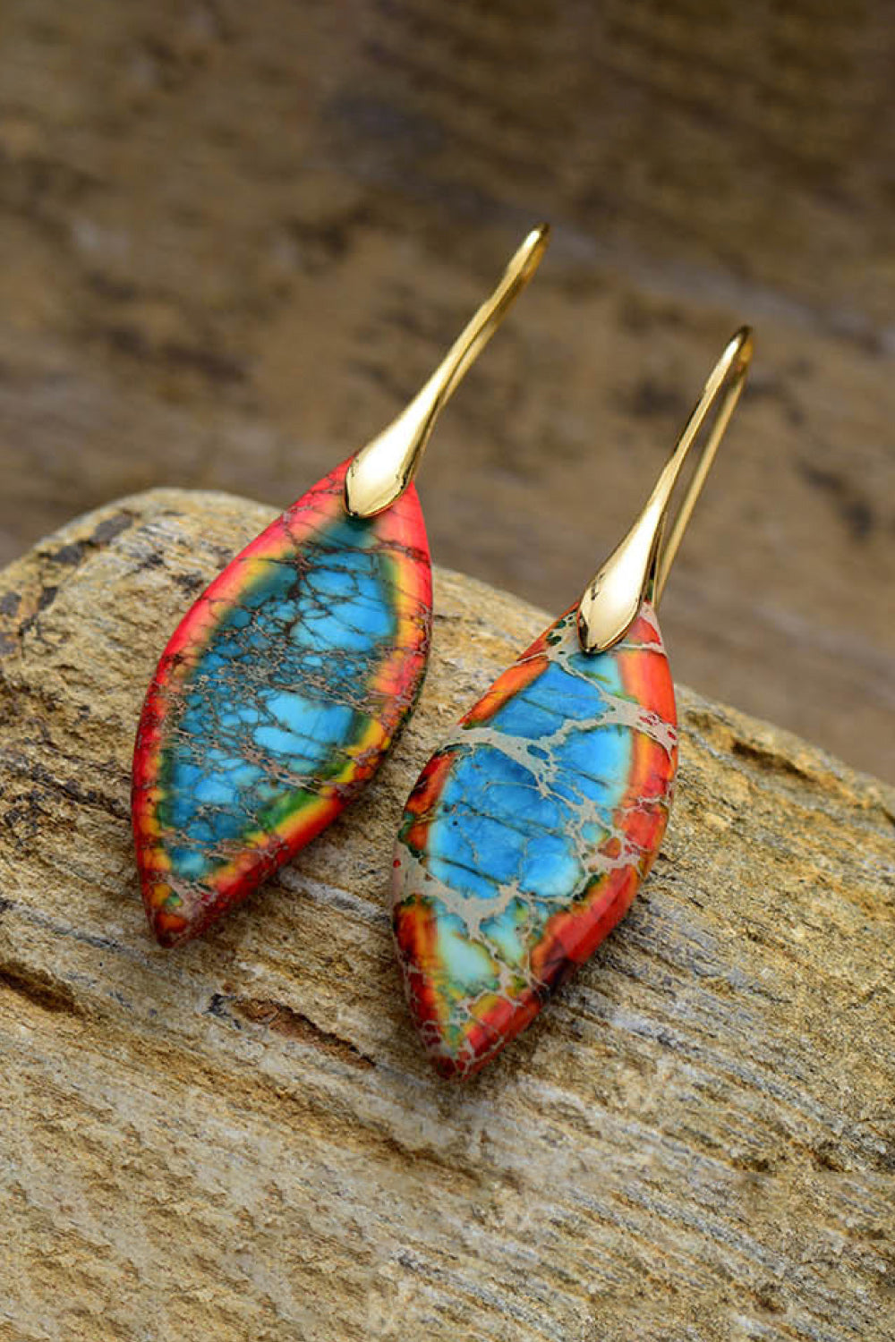 Handmade natural stone earrings featuring colorful blue and red stones with gold hooks