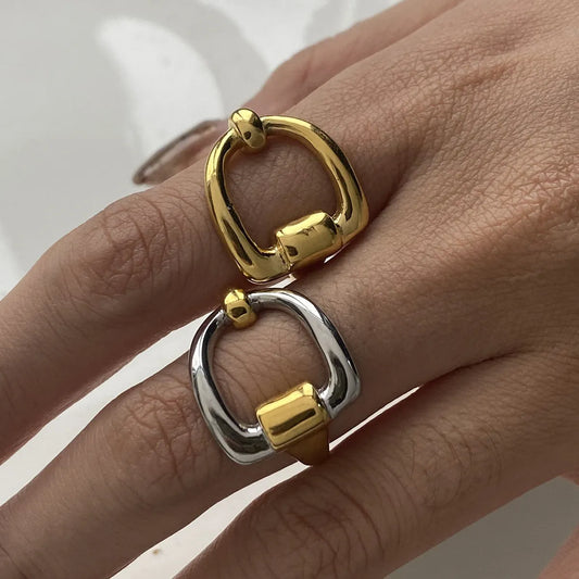 Trendy modern two-tone jewelry featuring gold and silver rings for stylish accessorizing