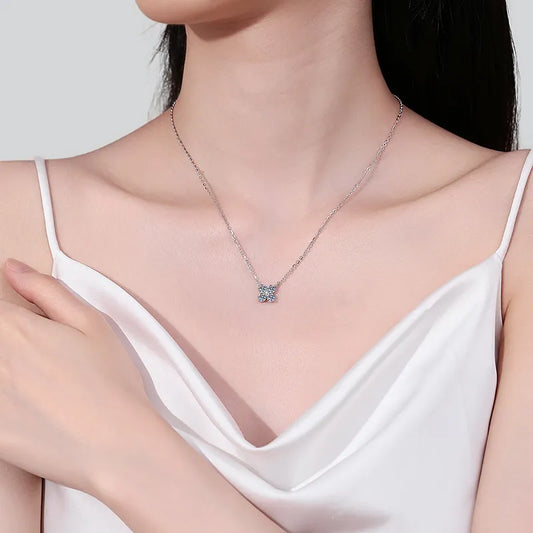 Elegant woman wearing a silver necklace featuring a 1.26 carat moissanite pendant for a sparkling look
