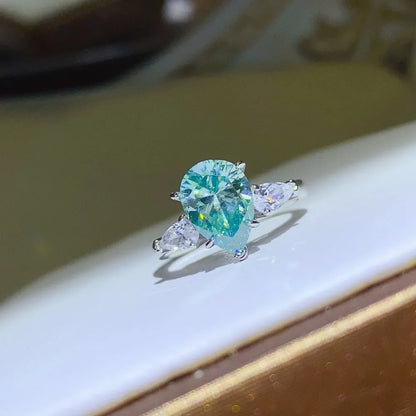 2 carat moissanite silver ring with a pear-shaped center stone and accent stones for elegant sparkle