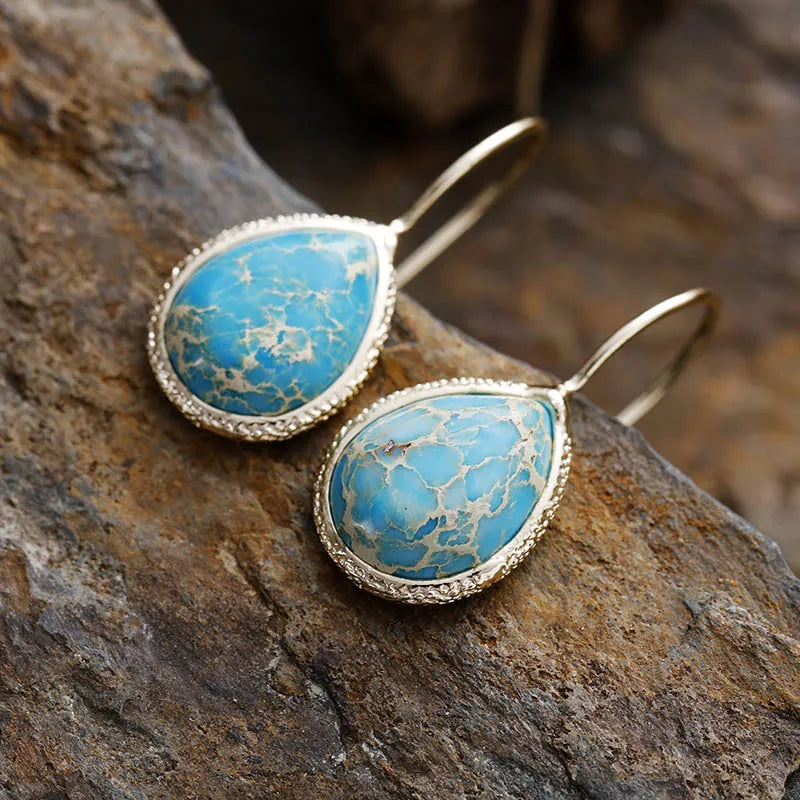 Trendy natural stone drop earrings with turquoise gemstone set in gold-tone metal
