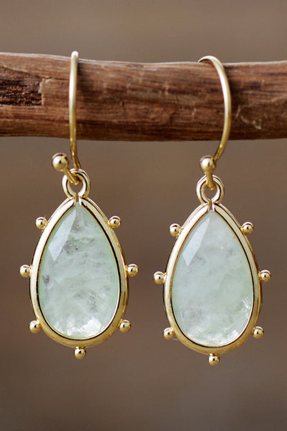 Elegant natural stone earrings featuring teardrop-shaped stones in a gold setting