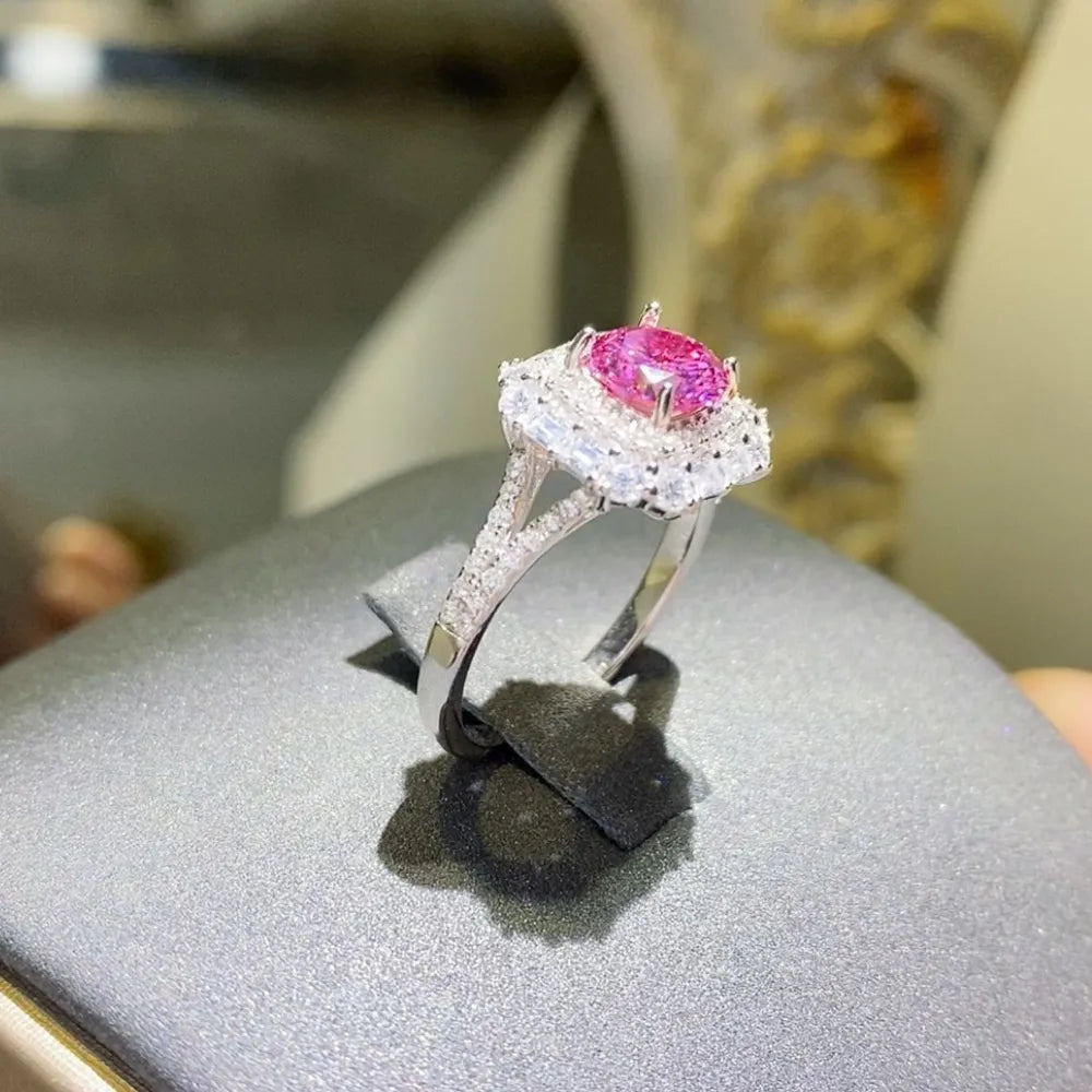 Elegant pink gemstone cocktail ring in silver with intricate detailing and sparkle
