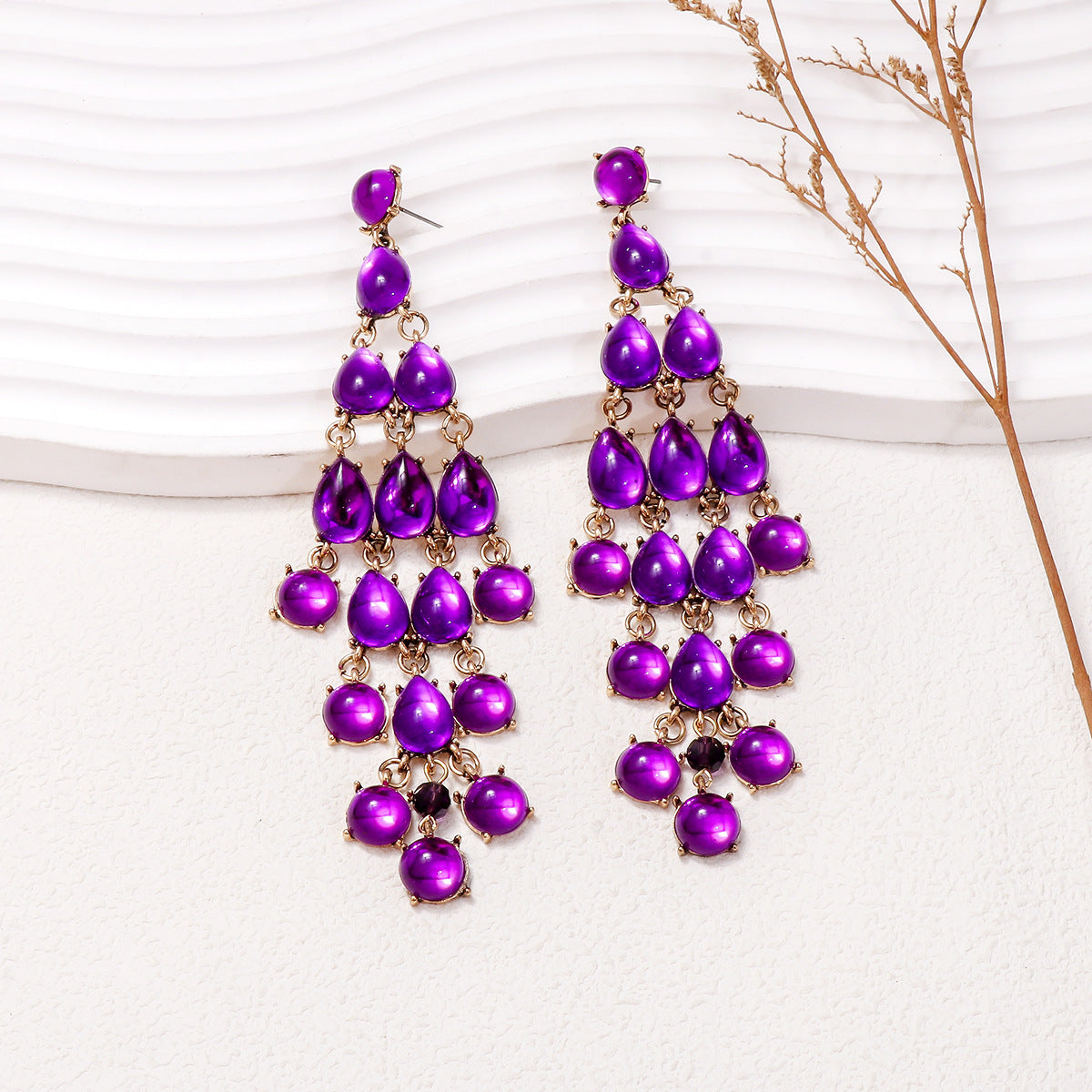 Elegant purple chandelier earrings with cascading teardrop design for stylish outfits