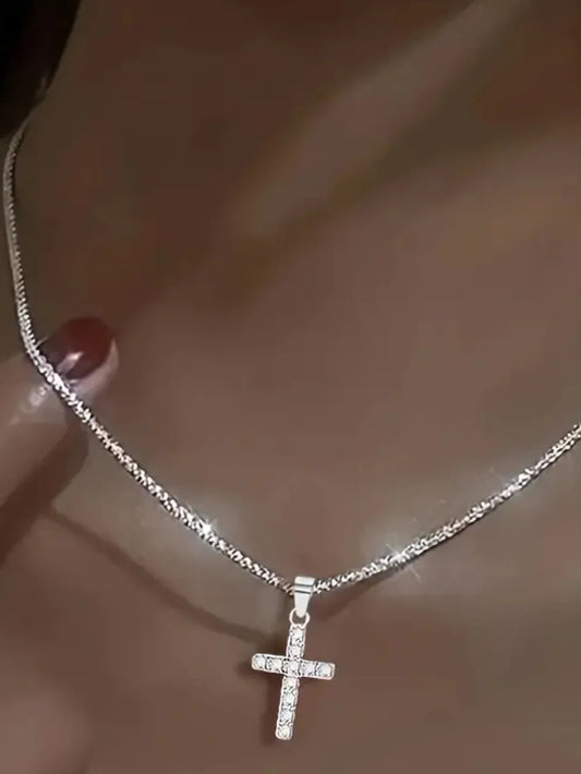 Elegant silver cross necklace for women featuring a sparkling design and delicate chain