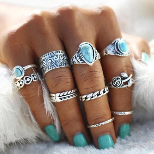 Set of stackable turquoise rings in silver with intricate designs and stones for a stylish bohemian look