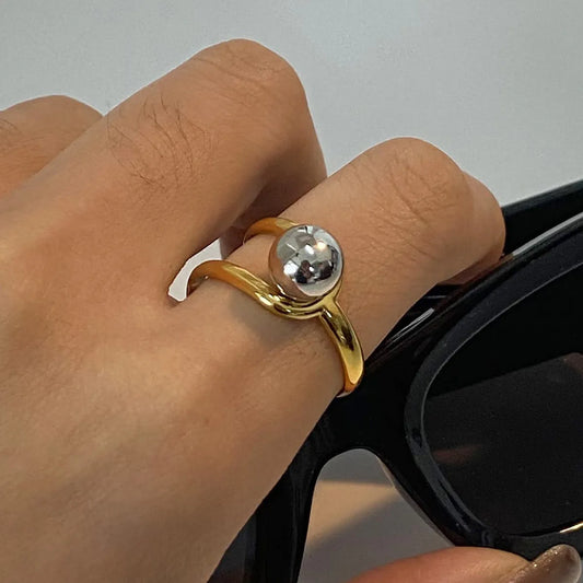 Trendsi stainless steel two-tone ring featuring a unique design with a glossy silver and gold finish