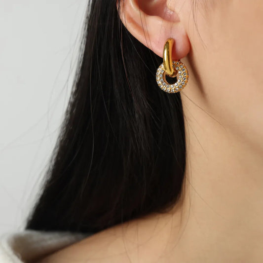 Stylish hoop earrings for women featuring a gold design with sparkling stones