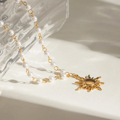 Elegant sun charm jewelry necklace with pearl beads and gold accents for a stylish look