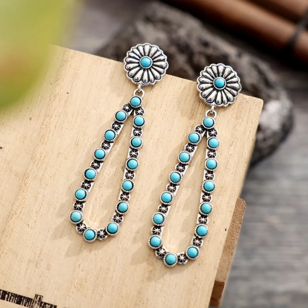 Trendsi turquoise teardrop earrings with floral design and silver accents for a stylish look