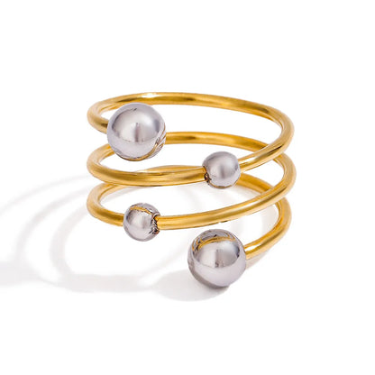 two-tone spiral ring featuring gold and silver tones with a stylish design