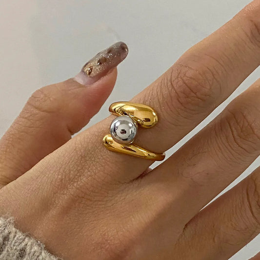 Trendsi two-tone twisted ring featuring a gold and silver design for stylish everyday wear