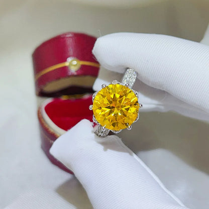 Elegant yellow moissanite ring set in a sparkling silver band with a detailed design