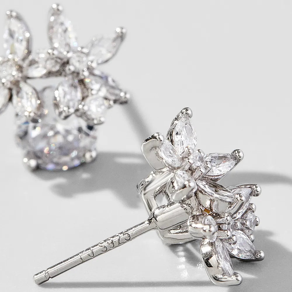Trendsi zircon flower stud earrings featuring intricate floral design with sparkling stones